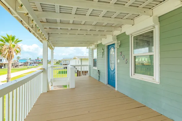 a view of a bathroom with a tub and balcony
