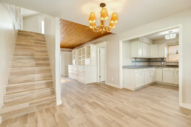 a view of a kitchen with a sink and cabinets