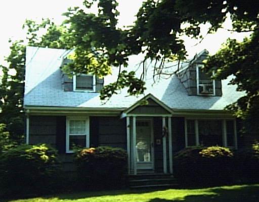 679 Rowland Road Fairfield, CT 06824 - Photo 1 of 1 a front view of a house with a garden