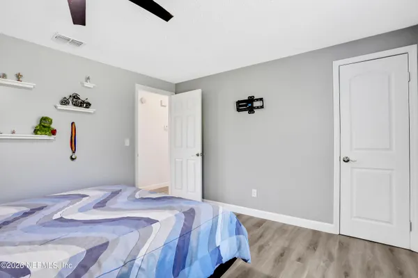 a bedroom with a bed and cabinets