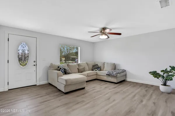 a living room with furniture and a window