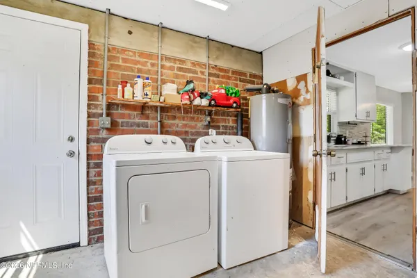 a utility room with dryer and washer
