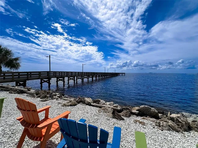 a view of a backyard with sitting area