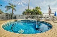 a view of a swimming pool with a patio