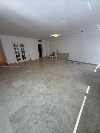 a view of a kitchen with refrigerator and a stove