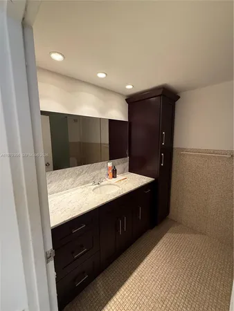 a bathroom with a sink and mirror