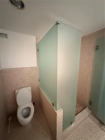 a bathroom with a toilet and a sink