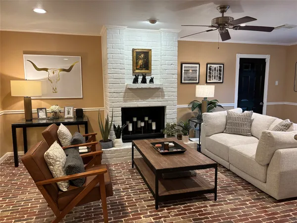 a living room with furniture and a fireplace