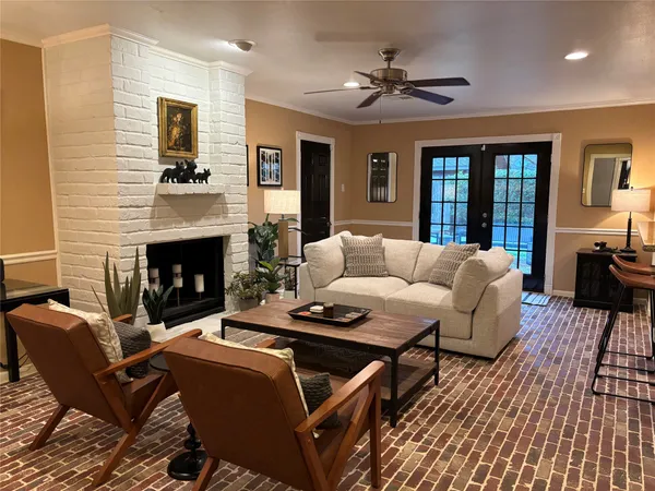 a living room with furniture and a fireplace