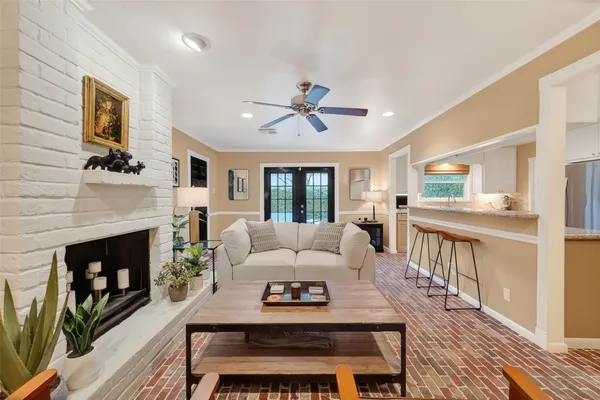 a living room with furniture and a fireplace