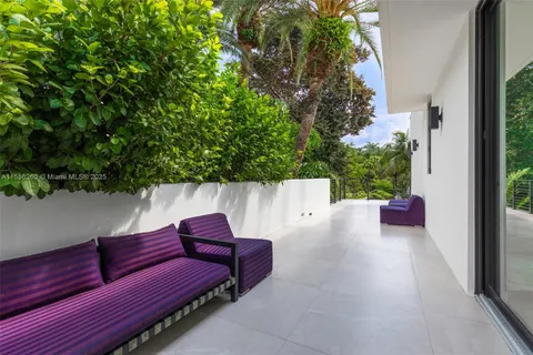a view of sitting area with furniture and wooden floor