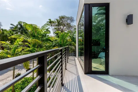 a view of balcony with wooden floor