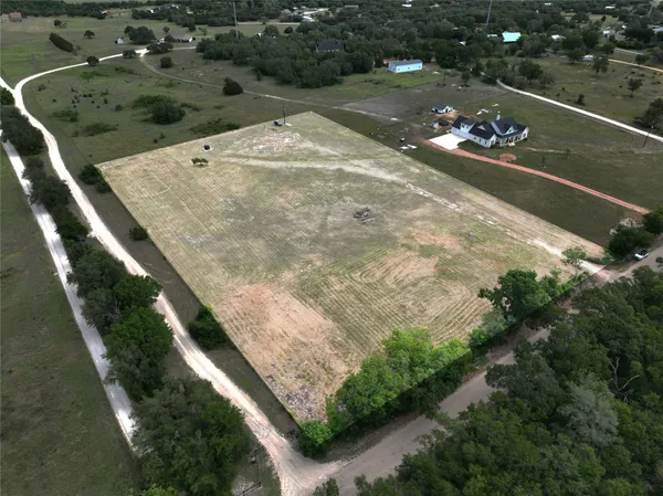 a view of a lake with a yard