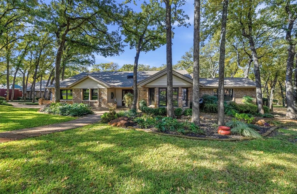 1607 North Main Street Euless, TX 76039 - Photo 13 of 40 a front view of a house with a yard