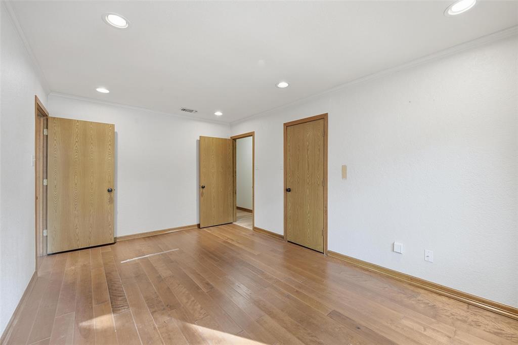 1607 North Main Street Euless, TX 76039 - Photo 18 of 40 a view of an empty room with wooden floor and closet