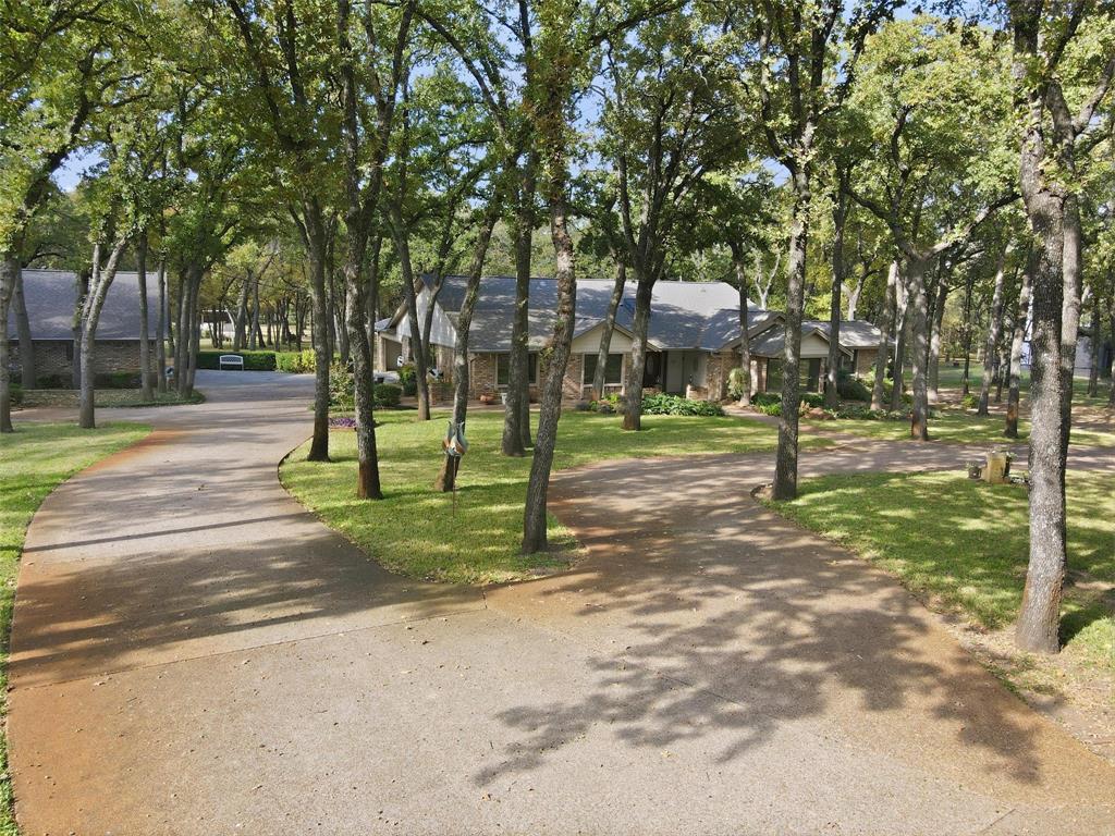 1607 North Main Street Euless, TX 76039 - Photo 2 of 40 a view of a park with tree s