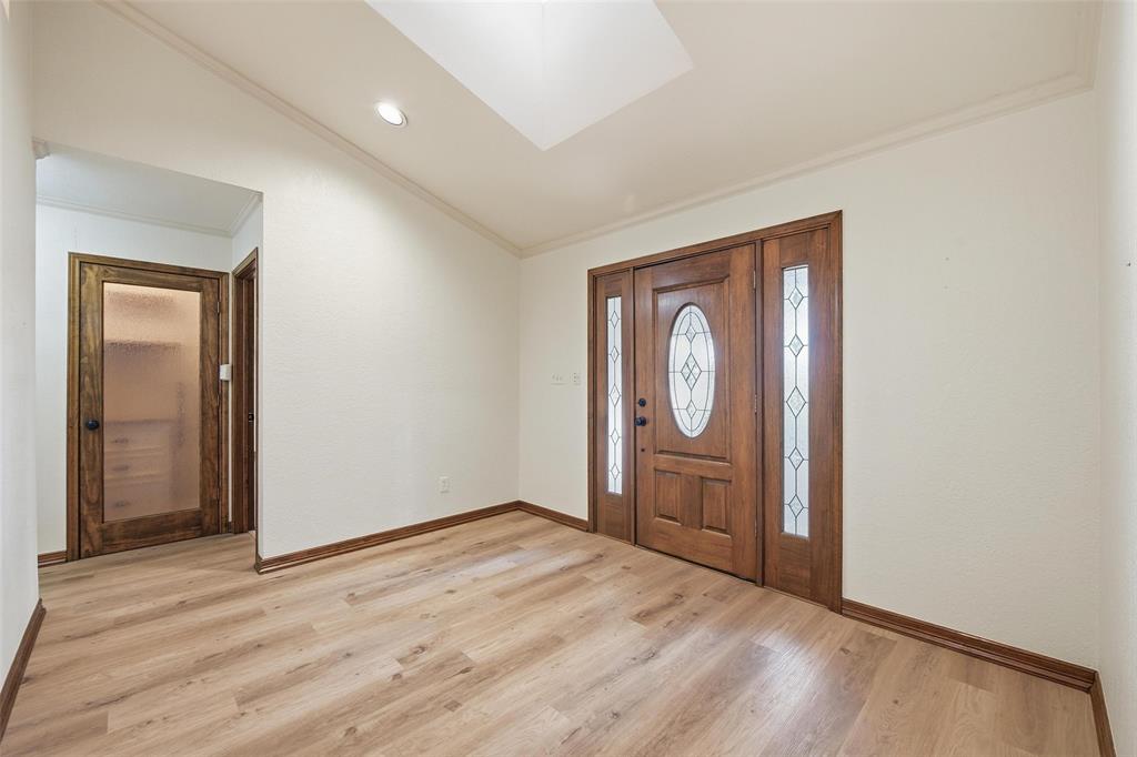 1607 North Main Street Euless, TX 76039 - Photo 22 of 40 a big room with wooden floor and window
