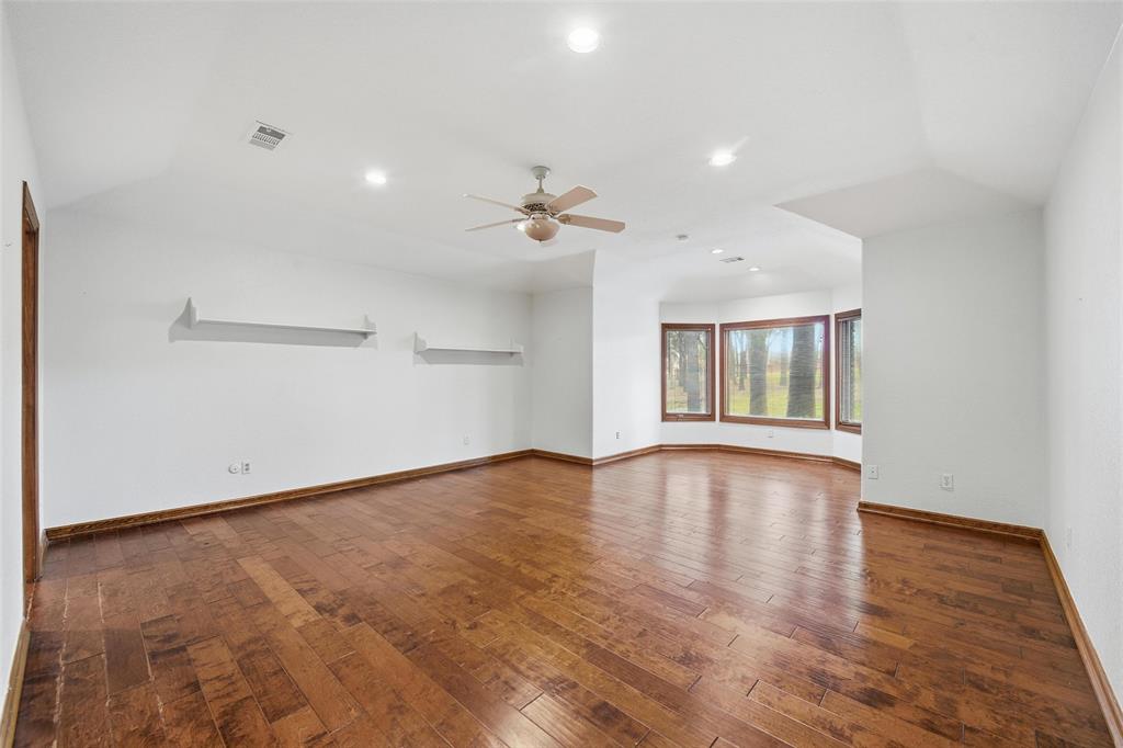 1607 North Main Street Euless, TX 76039 - Photo 24 of 40 wooden floor in an empty room with a window