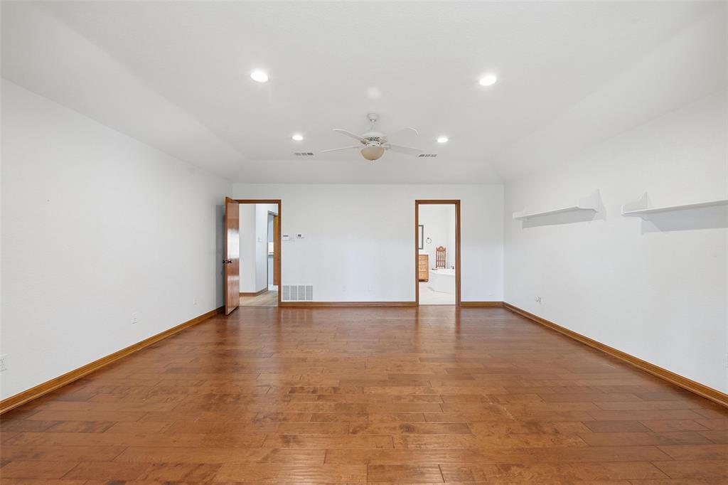 1607 North Main Street Euless, TX 76039 - Photo 25 of 40 a view of an empty room with wooden floor