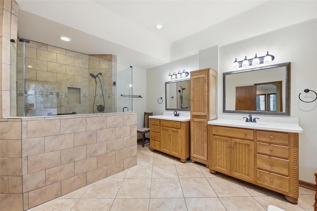 1607 North Main Street Euless, TX 76039 - Photo 27 of 40 a spacious bathroom with a double vanity sink mirror and bathtub