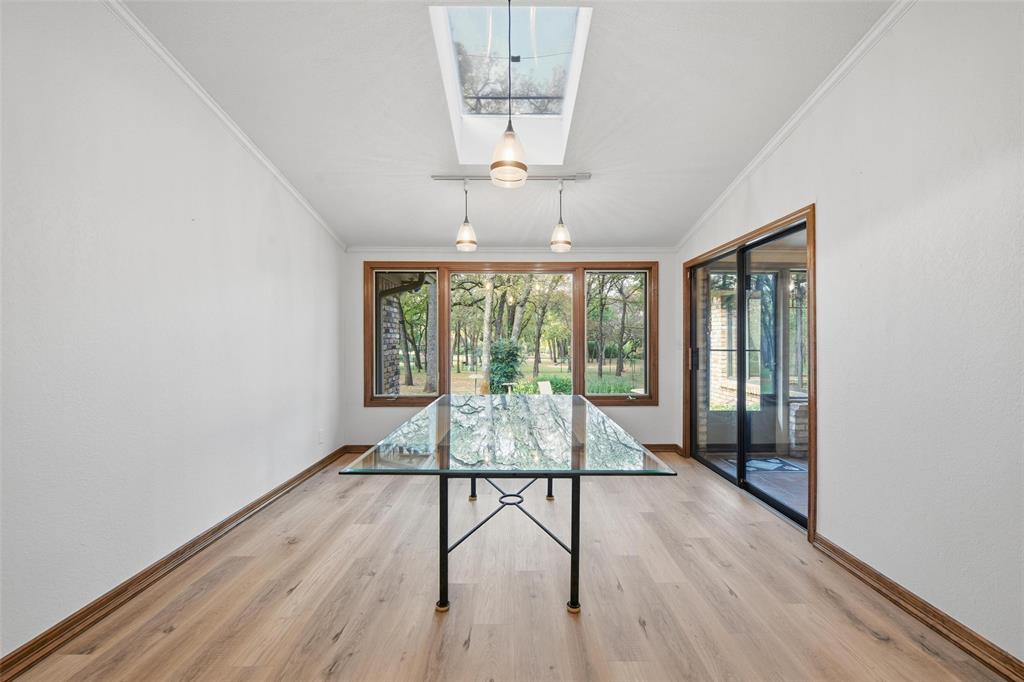 1607 North Main Street Euless, TX 76039 - Photo 31 of 40 a living room with hardwood floor and large window