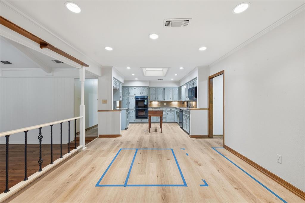 1607 North Main Street Euless, TX 76039 - Photo 33 of 40 a view of a kitchen with cabinets and wooden floor