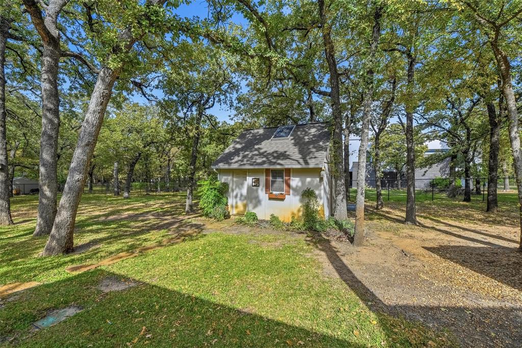 1607 North Main Street Euless, TX 76039 - Photo 7 of 40 a view of a house with a yard