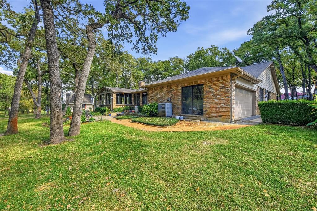 1607 North Main Street Euless, TX 76039 - Photo 9 of 40 a view of a house with backyard and sitting area