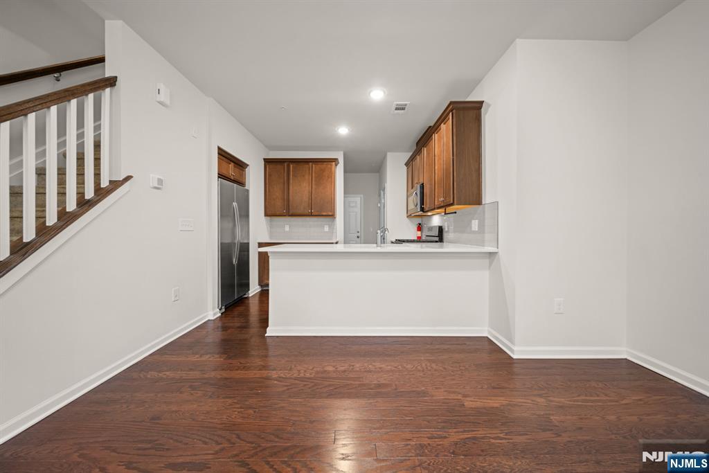 39 Arnold Drive Wood-Ridge, NJ 07075 - Photo 11 of 49 a view of kitchen with granite countertop cabinets and refrigerator