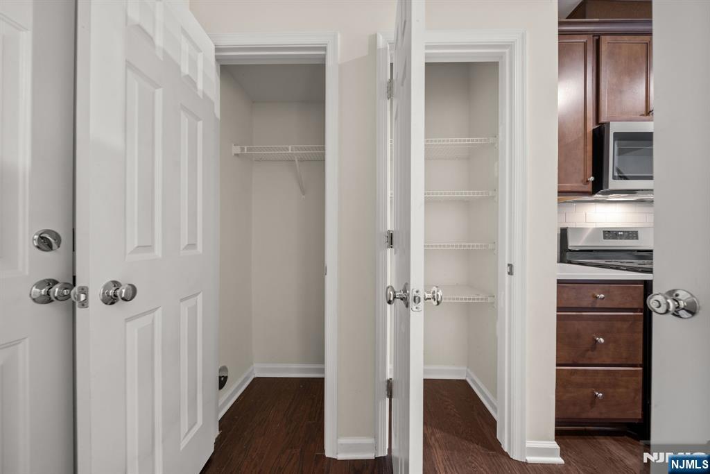 39 Arnold Drive Wood-Ridge, NJ 07075 - Photo 18 of 49 a view of a walk in closet and bedroom