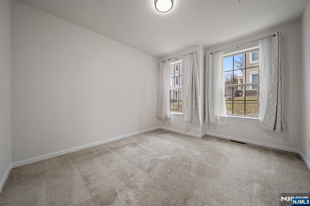 39 Arnold Drive Wood-Ridge, NJ 07075 - Photo 20 of 49 an empty room with windows