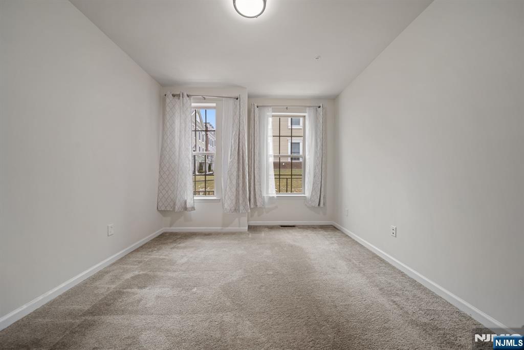 39 Arnold Drive Wood-Ridge, NJ 07075 - Photo 21 of 49 an empty room with windows