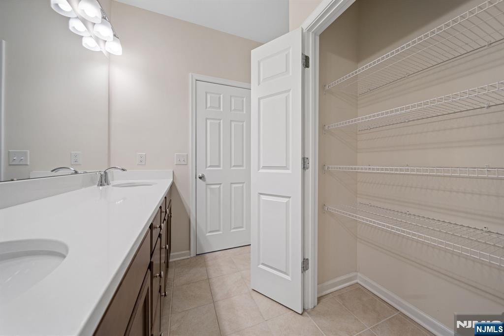 39 Arnold Drive Wood-Ridge, NJ 07075 - Photo 25 of 49 a bathroom with a sink vanity and a mirror