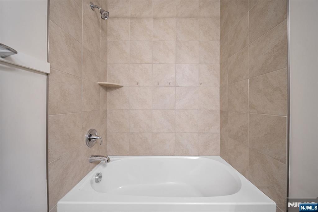 39 Arnold Drive Wood-Ridge, NJ 07075 - Photo 26 of 49 a bathroom with a bathtub