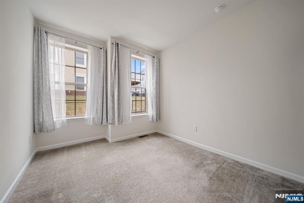 39 Arnold Drive Wood-Ridge, NJ 07075 - Photo 27 of 49 an empty room with windows
