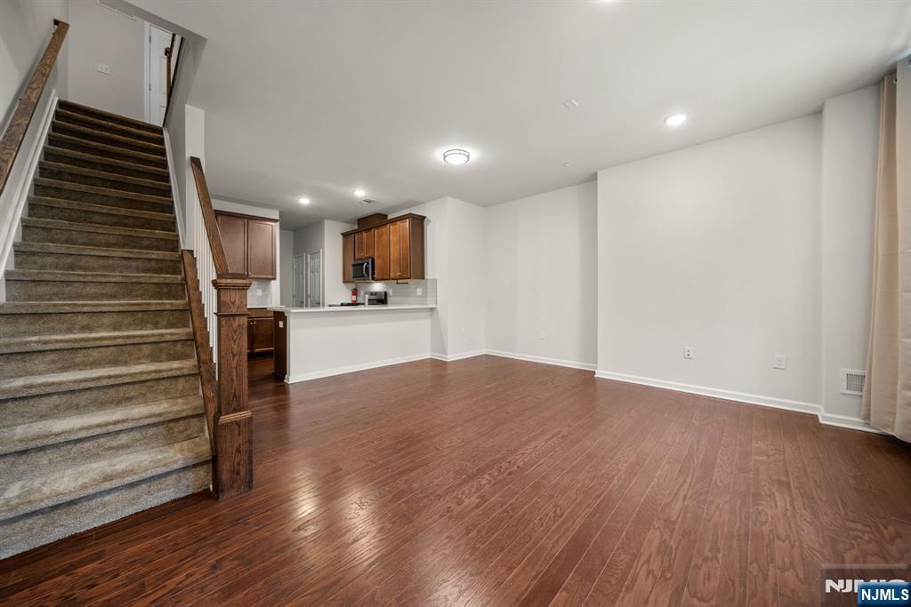 39 Arnold Drive Wood-Ridge, NJ 07075 - Photo 5 of 49 a view of kitchen with wooden floor electronic appliances and stairs