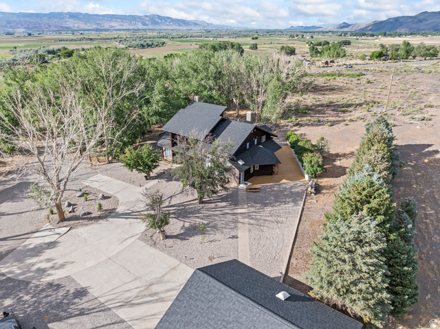 460 Omni Point Road Central Valley, UT 84754 - Photo 101 of 101 Expansive property featuring a dark-toned residence with multiple gables and a gravel driveway