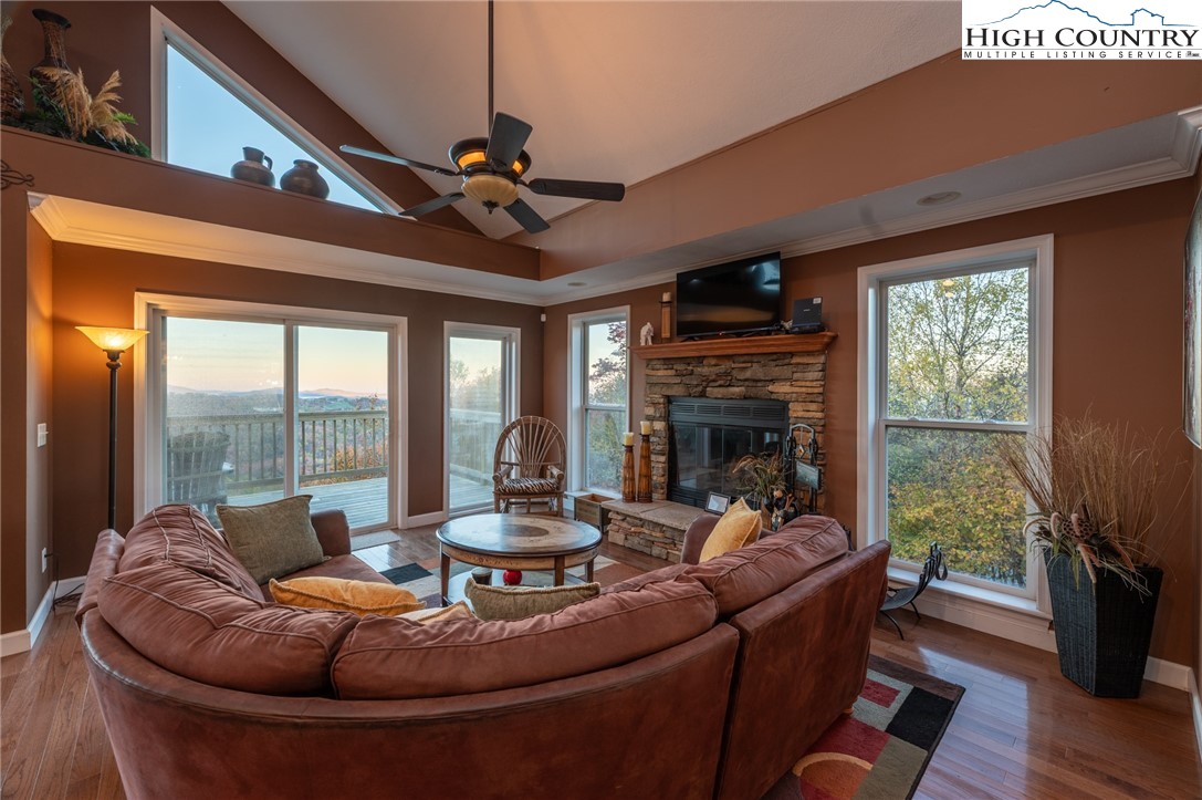 309 Pinnacle Ridge Road Beech Mountain, NC 28604 - Photo 12 of 45 a living room with fireplace furniture and a flat screen tv