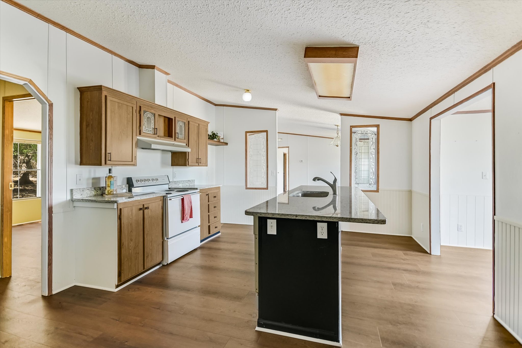 217 Rousey Street Canyon Lake, TX 78133 - Photo 16 of 25 a kitchen with stainless steel appliances granite countertop a stove and a refrigerator