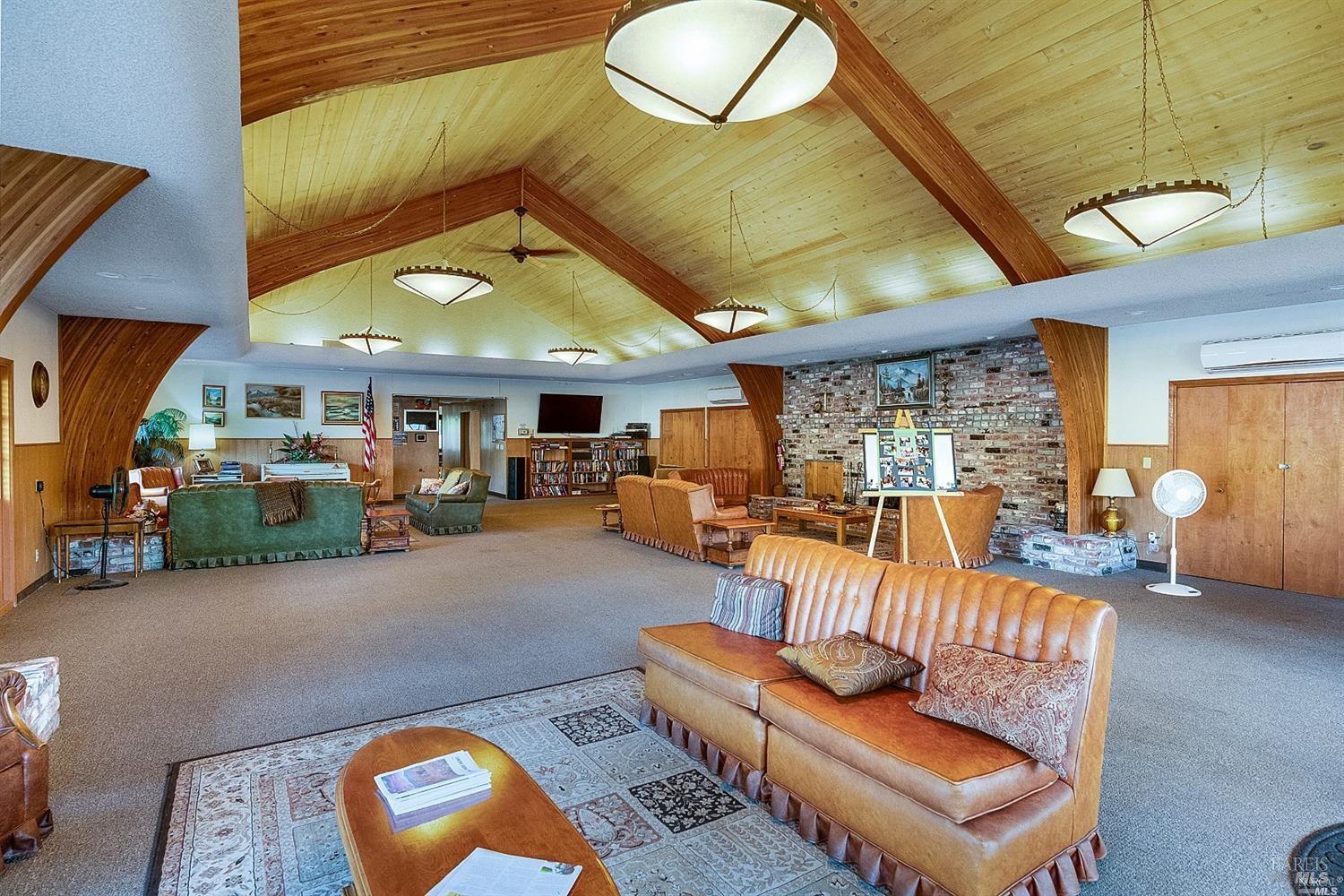 600 Colonial Park Drive Santa Rosa, CA 95403 - Photo 29 of 34 a living room with furniture a couch and a chandelier
