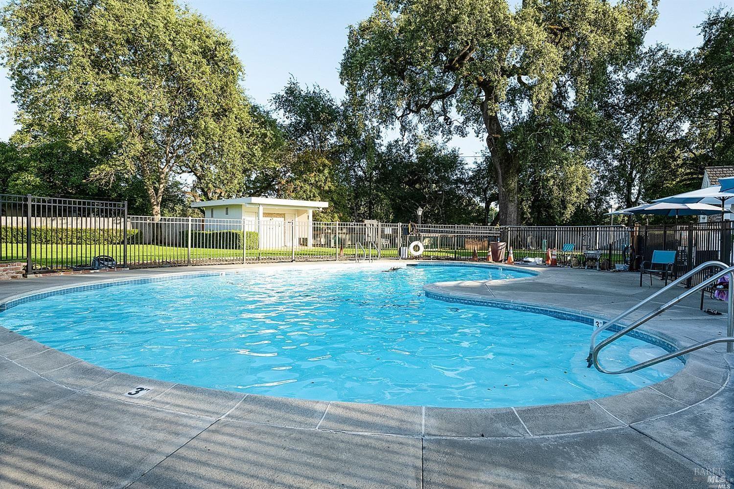 600 Colonial Park Drive Santa Rosa, CA 95403 - Photo 30 of 34 a view of a swimming pool with a yard
