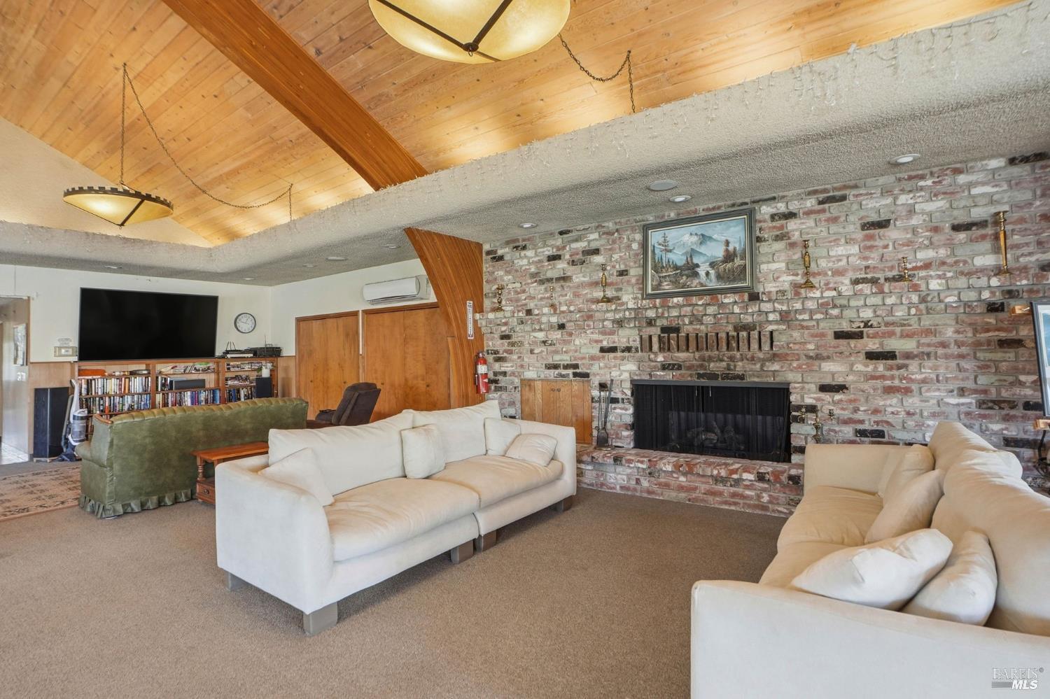 600 Colonial Park Drive Santa Rosa, CA 95403 - Photo 31 of 34 a living room with furniture and a flat screen tv