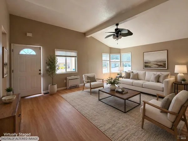 a kitchen with granite countertop a refrigerator a sink dishwasher stove and wooden cabinets
