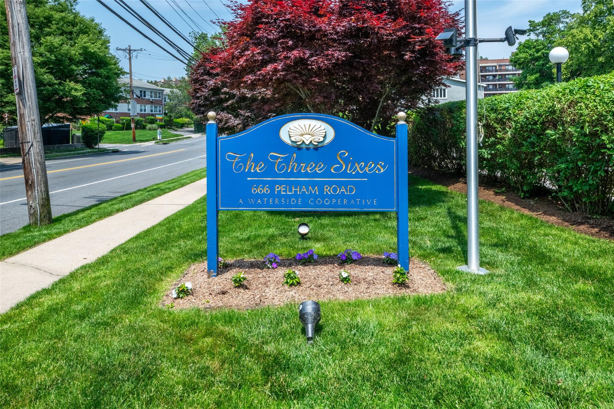 666 Pelham Road, Unit 6K New Rochelle, NY 10805 - Photo 1 of 1 a sign that is sitting on the side of a road