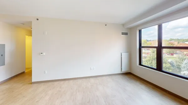 a view of an empty room with a window