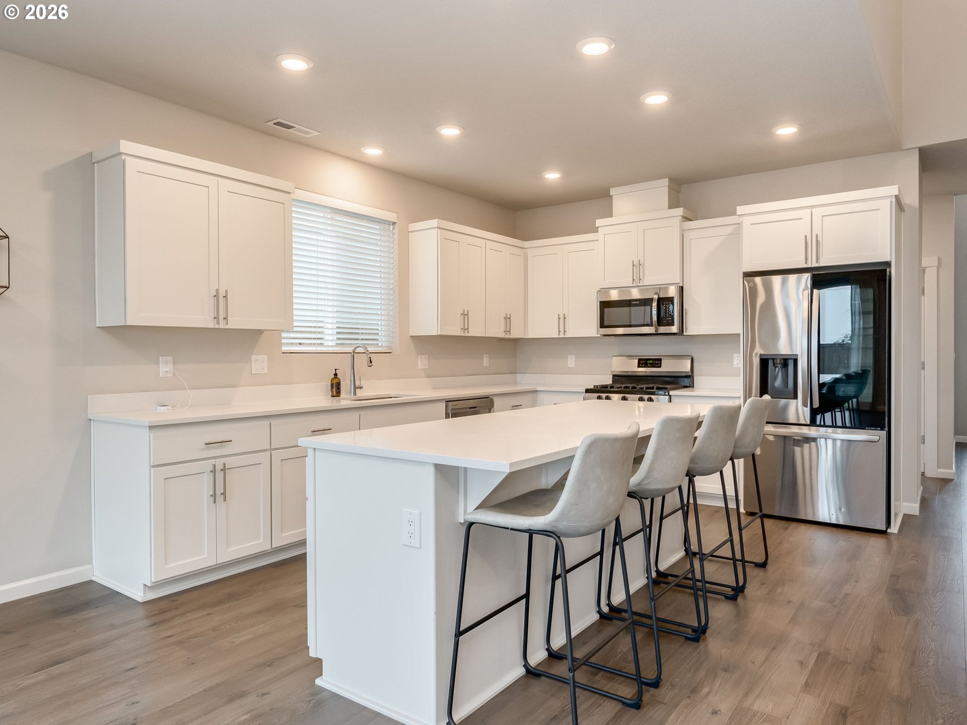 1663 Northwest Edgar Street McMinnville, OR 97128 - Photo 13 of 44 a kitchen with appliances a sink a counter top space and cabinets
