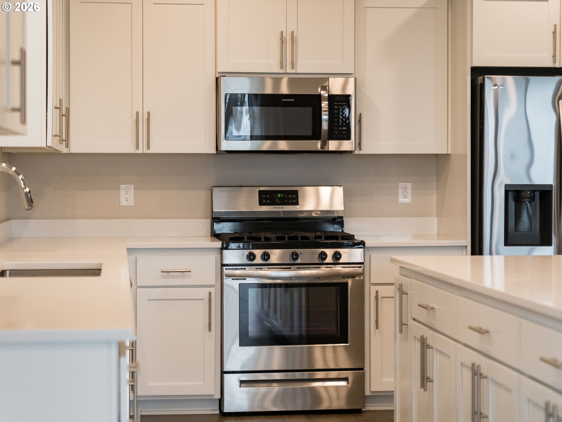 1663 Northwest Edgar Street McMinnville, OR 97128 - Photo 17 of 44 a kitchen with stainless steel appliances granite countertop a stove microwave and oven