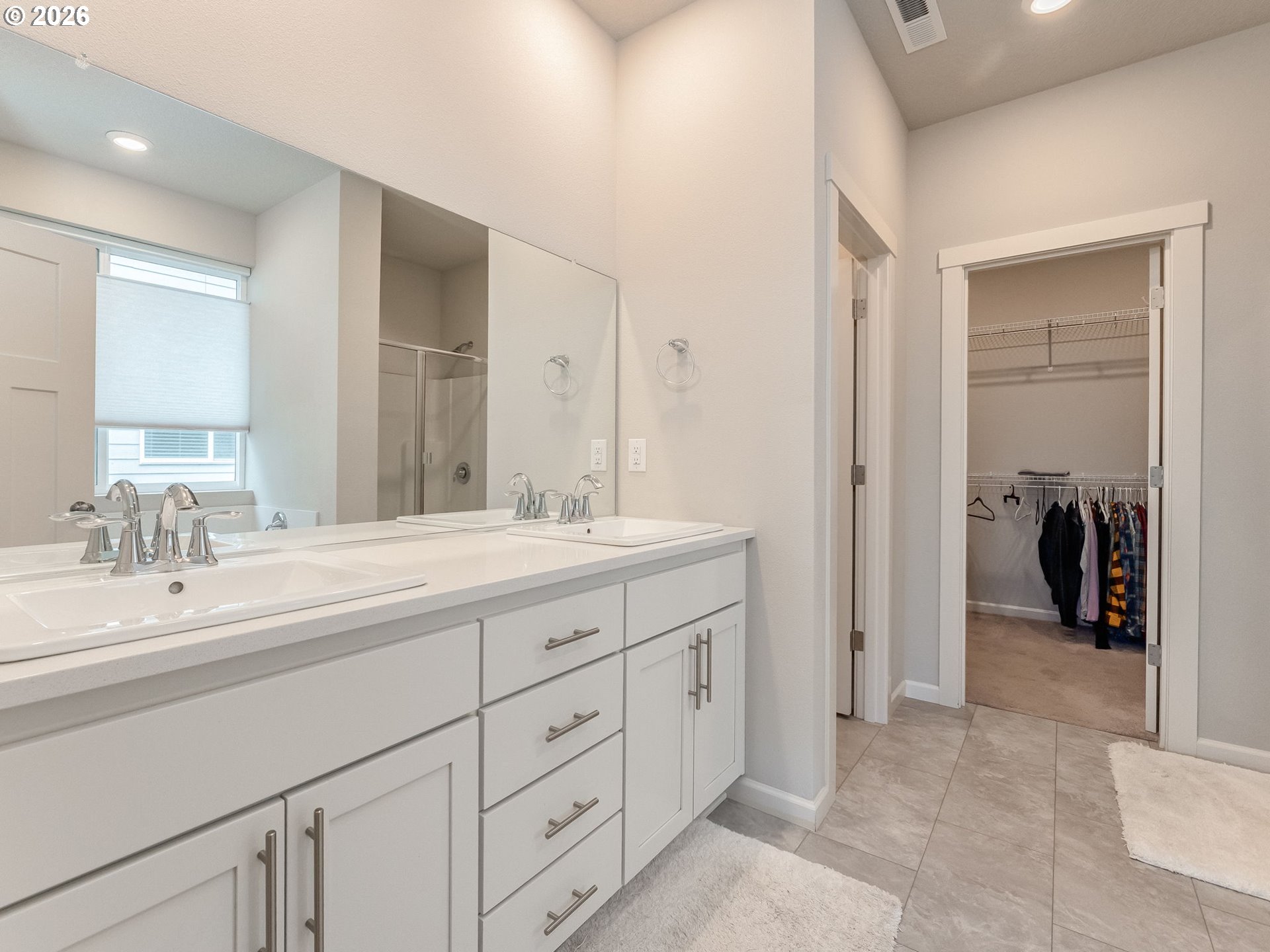 1663 Northwest Edgar Street McMinnville, OR 97128 - Photo 25 of 44 a spacious bathroom with a double vanity sink and a mirror