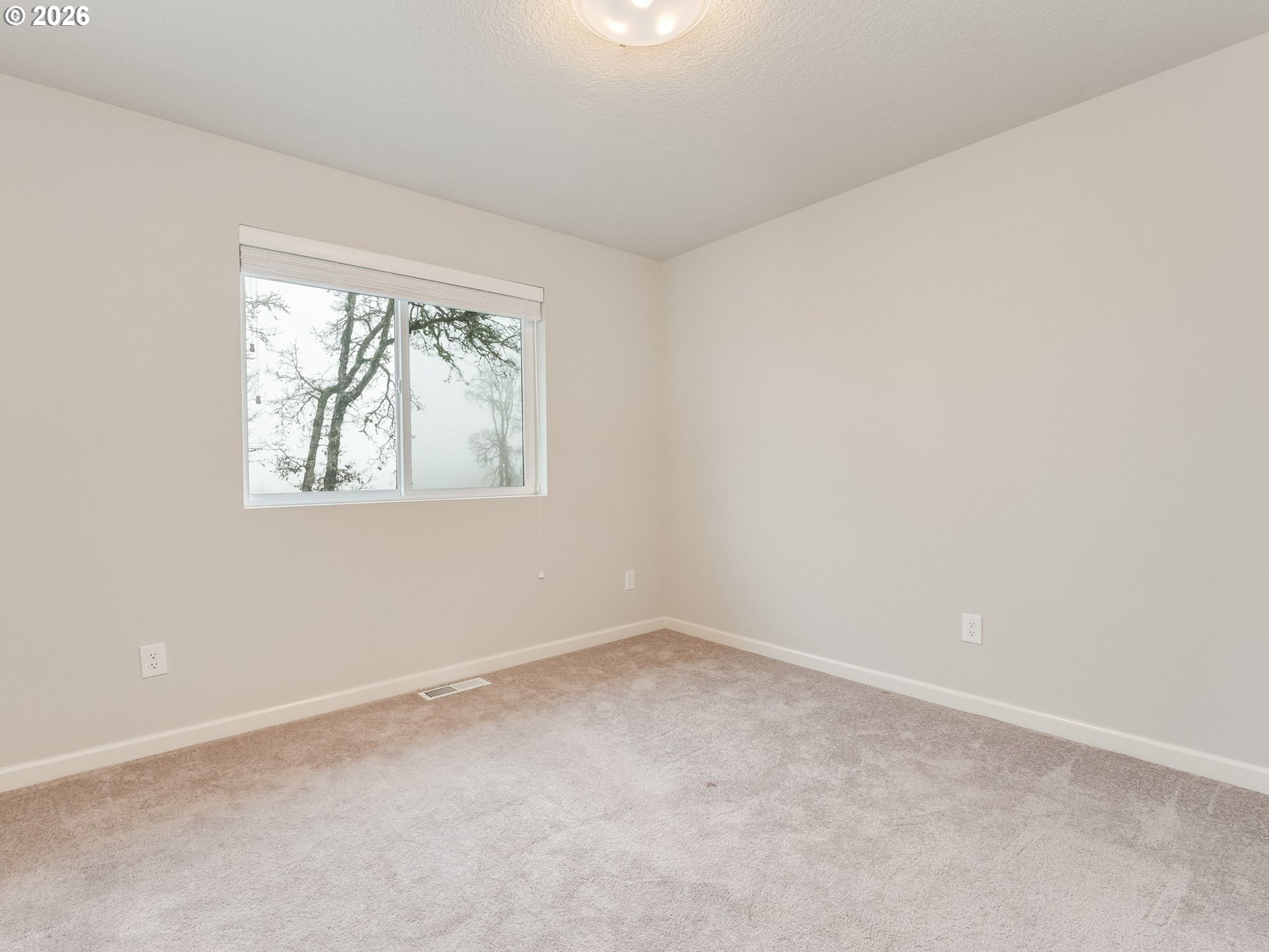 1663 Northwest Edgar Street McMinnville, OR 97128 - Photo 33 of 44 an empty room with a window