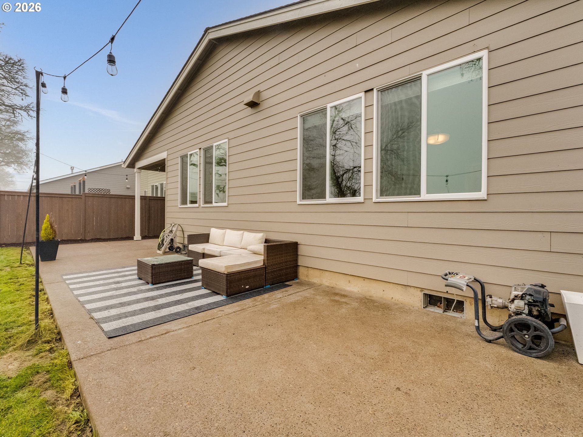 1663 Northwest Edgar Street McMinnville, OR 97128 - Photo 42 of 44 a backyard of a house with barbeque oven and glass windows